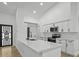 Modern kitchen featuring white countertops, stainless steel appliances, and a functional island with a sink at 274 W 20Th St, Apopka, FL 32703