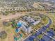 Bird's eye view of the community amenities including pool, clubhouse, golf course and well manicured lawns at 3008 Pinnacle Ct, Clermont, FL 34711
