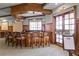 A community bar area featuring rich wood tones, seating, and an inviting place to socialize with neighbors at 3008 Pinnacle Ct, Clermont, FL 34711