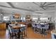 Modern bar with ample seating, televisions, a white stone backsplash, and a lively atmosphere at 3008 Pinnacle Ct, Clermont, FL 34711