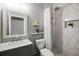 Nicely renovated bathroom has a walk-in shower and a grey vanity at 3008 Pinnacle Ct, Clermont, FL 34711