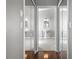 View of the bathroom entrance featuring mirrored closet doors and a pedestal sink at 3008 Pinnacle Ct, Clermont, FL 34711