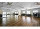 Spacious dance studio with hardwood floors, mirrored walls, ceiling fans and neutral wall tones at 3008 Pinnacle Ct, Clermont, FL 34711