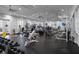 Well-equipped gym featuring modern weightlifting and cardio equipment and multiple ceiling fans at 3008 Pinnacle Ct, Clermont, FL 34711