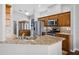Modern kitchen with stainless steel appliances, granite countertops, and ample cabinet space for a seamless cooking experience at 3008 Pinnacle Ct, Clermont, FL 34711