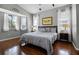 Light and bright primary bedroom with views from multiple windows and ensuite bathroom at 3008 Pinnacle Ct, Clermont, FL 34711
