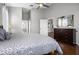 Primary bedroom boasts wood floors, an ensuite bathroom, and walk-in closet at 3008 Pinnacle Ct, Clermont, FL 34711