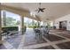 Inviting outdoor patio with comfortable seating, lush greenery, and beautiful views of the community at 3008 Pinnacle Ct, Clermont, FL 34711