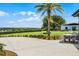 Relaxing outdoor patio with lush landscaping and views of the surrounding golf course and community at 3008 Pinnacle Ct, Clermont, FL 34711