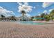 Inviting outdoor pool area with ample seating and a relaxing ambiance for residents to enjoy at 3008 Pinnacle Ct, Clermont, FL 34711
