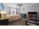 Comfortable bedroom with a ceiling fan and neutral decor at 308 Michael Blake Blvd, Winter Springs, FL 32708