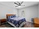 Bedroom with hardwood floors, a ceiling fan, and a door to a balcony at 308 Michael Blake Blvd, Winter Springs, FL 32708