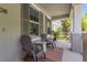 Welcoming front porch featuring comfortable seating, a small glass table, and neutral colors at 308 Michael Blake Blvd, Winter Springs, FL 32708
