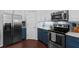 Modern kitchen showcasing stainless steel appliances, custom cabinets, and sleek countertops at 308 Michael Blake Blvd, Winter Springs, FL 32708