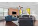 Bright living room featuring large windows, contemporary furniture, and hardwood floors at 308 Michael Blake Blvd, Winter Springs, FL 32708