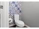 Charming powder room with colorful, decorative tiling at 308 Michael Blake Blvd, Winter Springs, FL 32708