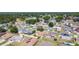 Real estate aerial view shows a neighborhood with houses, trees and roads at 310 Cornwallis Ct, Kissimmee, FL 34758