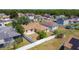 Aerial view of home showing backyard, patio, fence and surrounding neighborhood at 310 Cornwallis Ct, Kissimmee, FL 34758