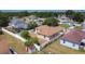Aerial view of backyard with white fence, shed and view of the community at 310 Cornwallis Ct, Kissimmee, FL 34758