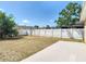 Well-maintained backyard with a white picket fence providing privacy and security for outdoor enjoyment at 310 Cornwallis Ct, Kissimmee, FL 34758