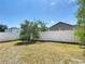Spacious backyard featuring a well maintained white fence that enhances privacy and defines the property at 310 Cornwallis Ct, Kissimmee, FL 34758