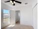 Cozy bedroom with ceiling fan, light wood floors, and closet at 310 Cornwallis Ct, Kissimmee, FL 34758