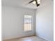 Bright bedroom featuring a ceiling fan, window and light wood flooring at 310 Cornwallis Ct, Kissimmee, FL 34758