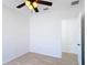 Bedroom featuring a ceiling fan, window, and light wood floors at 310 Cornwallis Ct, Kissimmee, FL 34758