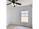 Bedroom featuring window, and wood-look flooring at 310 Cornwallis Ct, Kissimmee, FL 34758