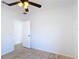 Bedroom features a ceiling fan, window, and light colored wood floors at 310 Cornwallis Ct, Kissimmee, FL 34758