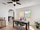 Dining area adjacent to kitchen featuring wood table and modern decor at 310 Cornwallis Ct, Kissimmee, FL 34758