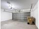 Functional two car garage with overhead lighting, automated door, and ample room for vehicles and storage at 310 Cornwallis Ct, Kissimmee, FL 34758