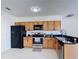 Modern kitchen featuring stainless steel appliances and neutral countertops at 310 Cornwallis Ct, Kissimmee, FL 34758