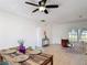 Inviting living room featuring a ceiling fan, a view of the outdoors, and an open layout at 310 Cornwallis Ct, Kissimmee, FL 34758