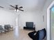 The living room has a ceiling fan and natural light, with modern style at 310 Cornwallis Ct, Kissimmee, FL 34758
