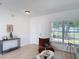 Bright living space featuring modern decor, wood floors, and a large window at 310 Cornwallis Ct, Kissimmee, FL 34758