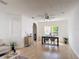 Bright living room featuring modern furnishings, wood floors, and a large window for natural light at 310 Cornwallis Ct, Kissimmee, FL 34758