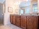 Elegant bathroom featuring granite countertops, dual sinks, and modern fixtures, offering a spa-like experience at 311 W Falls Dr, Kissimmee, FL 34747