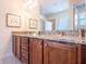 Elegant bathroom featuring granite countertops, dual sinks, and modern fixtures, offering a spa-like experience at 311 W Falls Dr, Kissimmee, FL 34747
