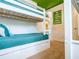 Fun bedroom featuring twin over twin bunk beds with a green ceiling at 311 W Falls Dr, Kissimmee, FL 34747