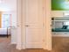 Hallway view showing bedroom with twin beds and adjacent room with bunk beds at 311 W Falls Dr, Kissimmee, FL 34747