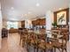 Open-concept dining area with large windows and seamless flow into the gourmet kitchen and living room at 311 W Falls Dr, Kissimmee, FL 34747