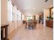 Bright dining area with tile floors, lots of natural light, a dining table and view to the kitchen at 311 W Falls Dr, Kissimmee, FL 34747