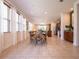 Bright dining area with tile floors, lots of natural light, a dining table and view to the kitchen at 311 W Falls Dr, Kissimmee, FL 34747