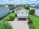 Beautiful two-story home with a brick driveway and a well-maintained landscaped front yard at 311 W Falls Dr, Kissimmee, FL 34747