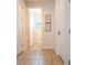 Hallway with doors and tile floors with natural lighting at 311 W Falls Dr, Kissimmee, FL 34747