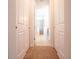 Hallway showing bathroom and closet doors at 311 W Falls Dr, Kissimmee, FL 34747
