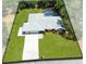 Aerial view of house, expansive green lawn, and large driveway at 3285 Majestic Oak Dr, St Cloud, FL 34771