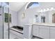 Bright bathroom with bathtub, tiled shower, white cabinetry, stone countertops, and natural light at 3285 Majestic Oak Dr, St Cloud, FL 34771