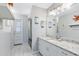 Bathroom featuring a sink with marble countertops and a shower with glass doors at 3285 Majestic Oak Dr, St Cloud, FL 34771